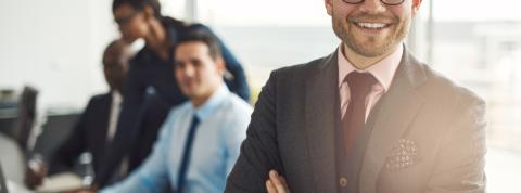 Confident business executive with folded arms
